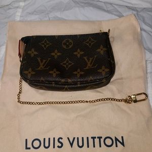 Louis VuittonAccessoires Pochette Leather Wristlet Mini 2019